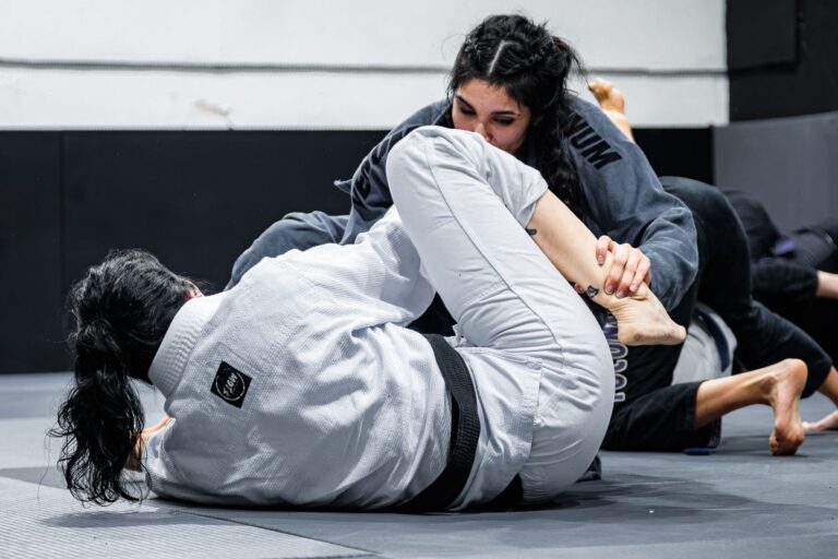Intense Brazilian Jiu-Jitsu competition showcasing advanced grappling techniques.